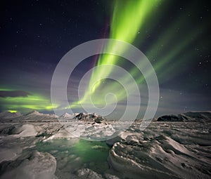 Unusual Arctic winter landscape - Frozen fjord & Northern Lights