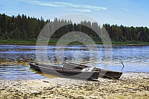 Unusual elongated wooden boats of the Mansi people in Siberia