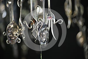 Quirky hanging mobiles made out of silver cutlery photo