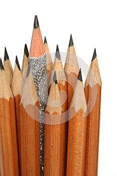 Unusual pencil in an environment of usual pencils photo