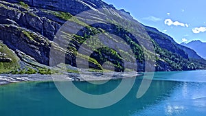 Unusual place in switzerland. Lake in mountains. Clouds in the sky.