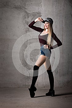 Unusual pose. Beautiful girl with long hair.sport,