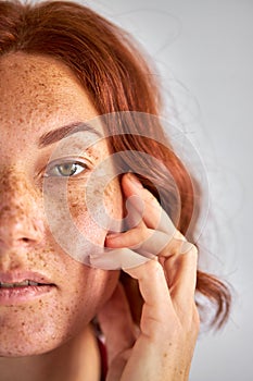 Unusual redhead woman looking at camera photo