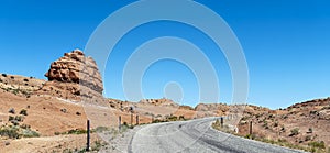 Unusual rock formations rise next to Notom Road Scenic Backway in the Grand Staircase-Escalante National Monument, Utah, USA