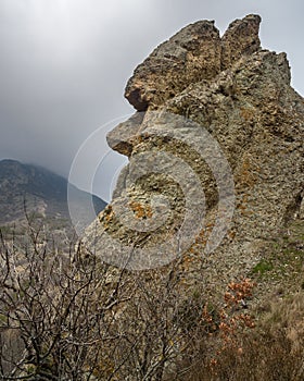 Unusual rock shape similar to human face profile. Landscape of Karadag Reserve in spring. Crimea