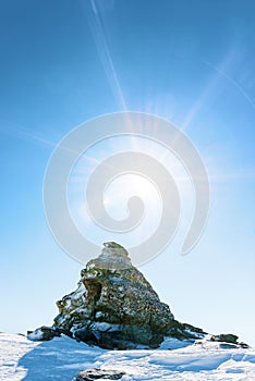 Unusual rock in the snowy mountains