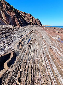 Unusual rock structure against the sea background, coastline, interesting geological object at Hallett Cove, Australia