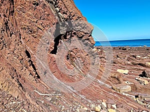 Unusual rock structure against the sea water background, interesting geological object at Hallett Cove, Australia