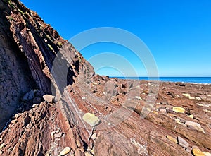 Unusual rock structure against the sea water background, interesting geological object at Hallett Cove, Australia