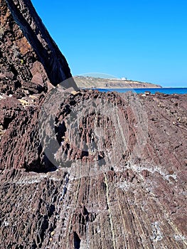 Unusual rock structure against the sea water background, interesting geological object at Hallett Cove, Australia