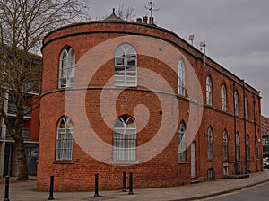 unusual Rounded red brick building