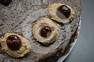 Unusual sponge cake with buttercream and cherries Drunken cherry.