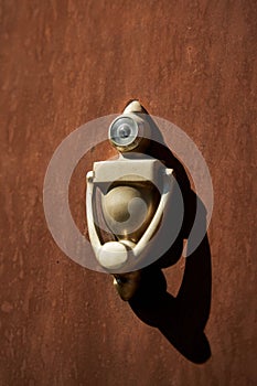 Unusual stylish door knocker in the shape of a robot