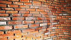 Unusual wall made of vintage red brick in modern loft. The camera moves from left to right. Concept of creative