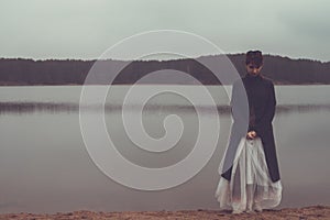 Unusual woman with balloons as concept outdoors