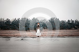 Unusual woman with balloons as concept outdoors