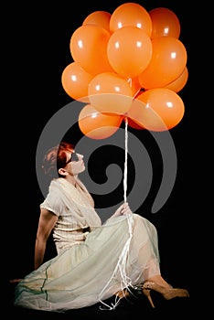 Unusual woman with balloons studio