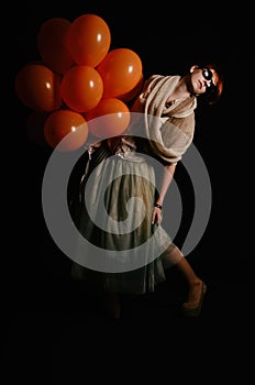 Unusual woman with balloons studio