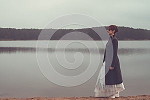 Unusual woman in long skirt as concept outdoors