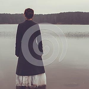 Unusual woman in long skirt as concept outdoors