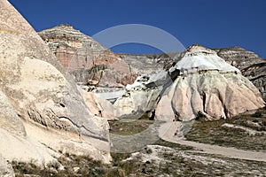 Unusually shaped volcanic rocks in the Pink Valley near the village of Goreme in the Cappadocia region