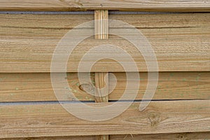 unvarnished slats of a wooden latticework for outdoor use