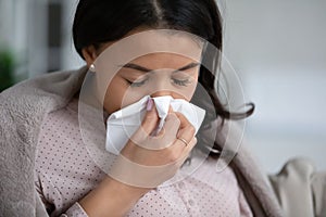 Unwell biracial woman have fever at home