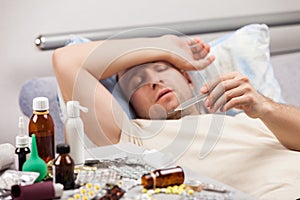 Unwell man patient lying down bed