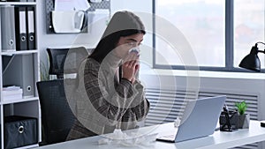 Unwell Woman Coughing At Work