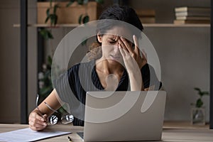 Unwell woman suffer from migraine overwhelmed with computer work
