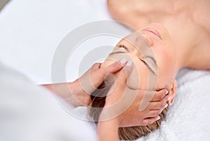 Unwinding at the day spa. a young woman enjyoing a massage at the day spa.