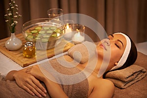 Unwinding and enjoying a touch of luxury. A young woman lying in a day spa.