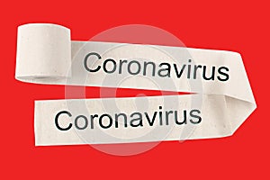 Unwound a toilet paper roll with the text Coronovirus, on a red background. The concept of warning and mass hysteria. photo