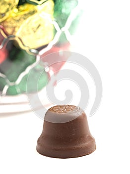 Unwrapped Bell Shaped Chocolate Candy on White Background