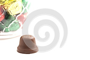 Unwrapped Bell Shaped Chocolate Candy on White Background