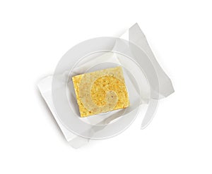 Unwrapped bouillon cube on white background, top view