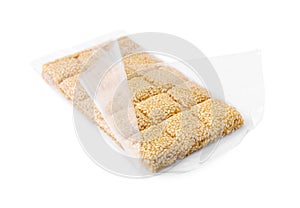 Unwrapped delicious sesame kozinaki bar isolated on white