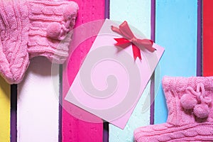Cute message card and pink bootees photo