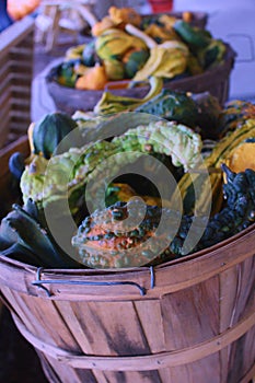 Up-close image of gourds in a basket at a Farmer`s Market