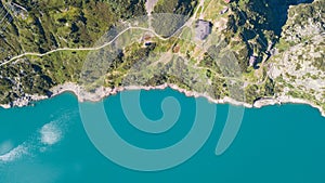 Up and down drone aerial view of the Lake Barbellino an alpine artificial lake. Italian Alps. Italy photo