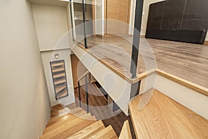 Up and down stairs of a residential loft house with wooden steps