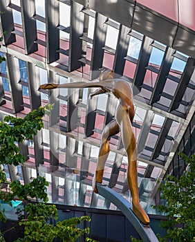 Up There-Sculpture on First Street, Manchester. One of five 2.5m sculptures set on 5m stainless steel columns by Collin