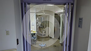 Up to down tilt video of a Japanese hospital of Tokyo in the IRM radiology department whose door display the words `X-RAY ROOM`,