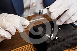 Up view of jewelry appraiser examining