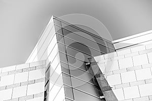 Up view on modern business office building and sky on the background. Urban exterior and tall perspective.