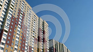 Up view of a new colored high rise building.