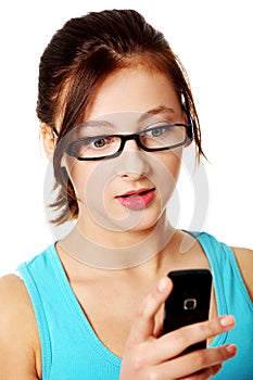 Upclose portrait of girl reading sms.