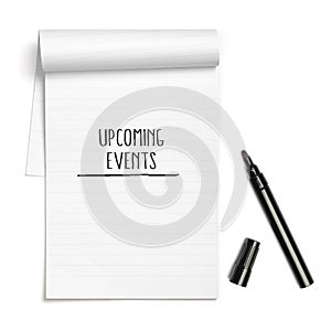 Upcoming Events headline on paper note book