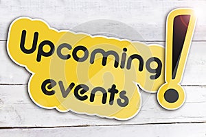 Upcoming events on wooden background