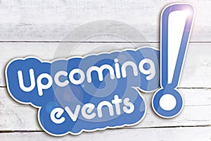 Upcoming events on wooden background